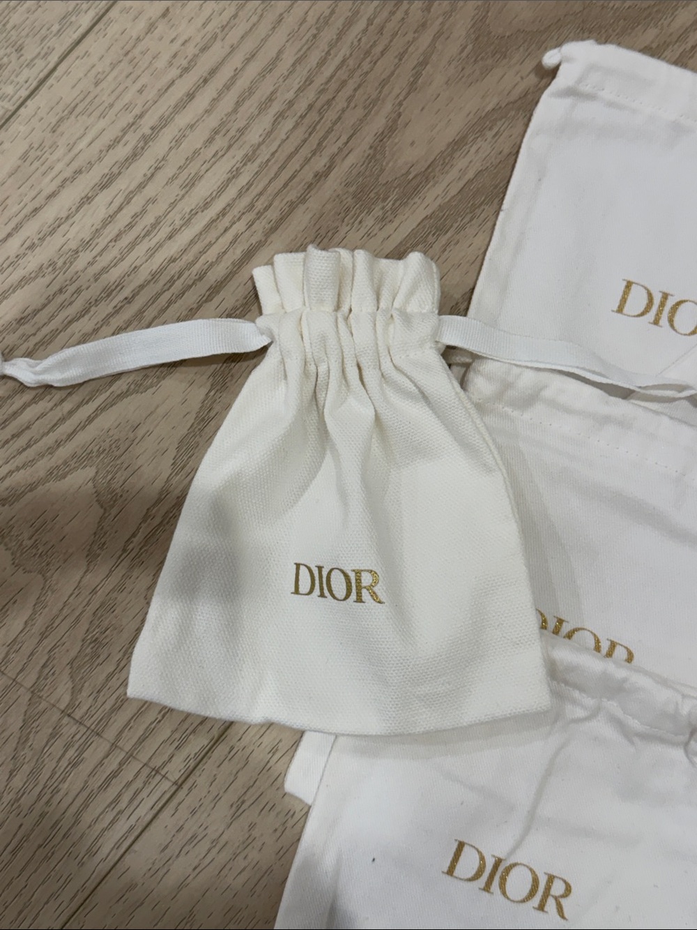 Dior Cream Drawstring Pouches with Gold Logo - Set of 7 - Picture 7 of 9